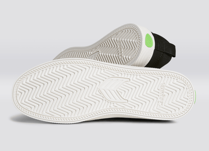 SLIP ON ブラックキャンバス オフホワイトロゴ スニーカー ウィメンズ